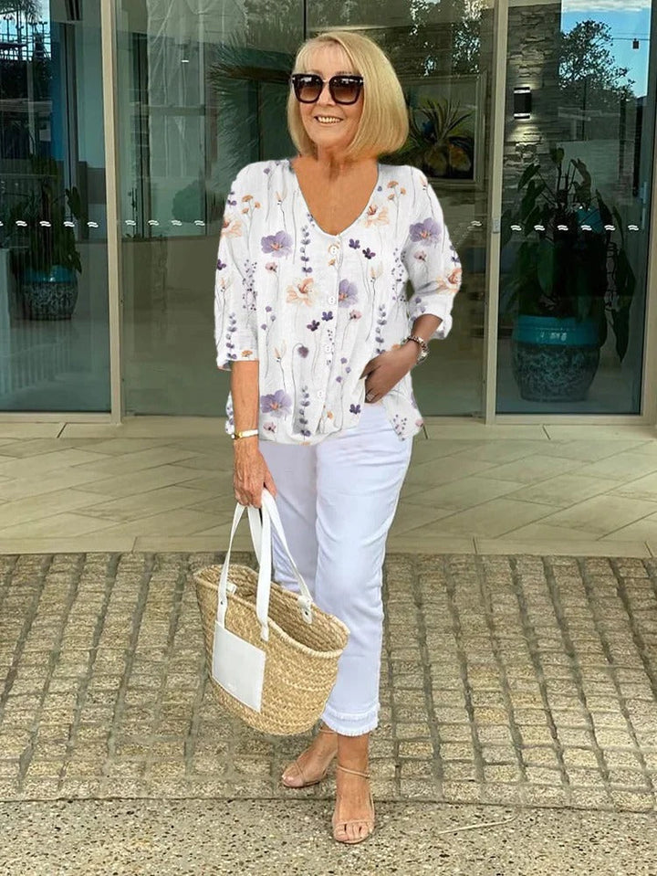 Floral three-quarter sleeve blouse worn