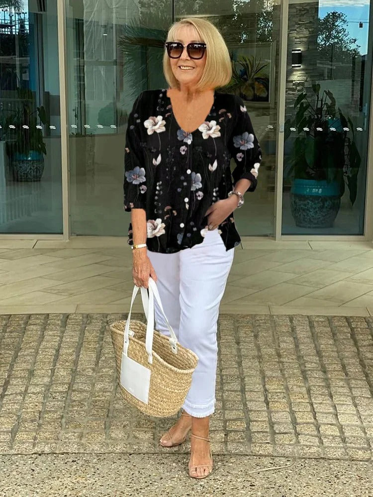 Floral three-quarter sleeve blouse worn