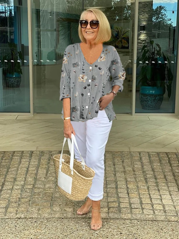 Floral three-quarter sleeve blouse worn