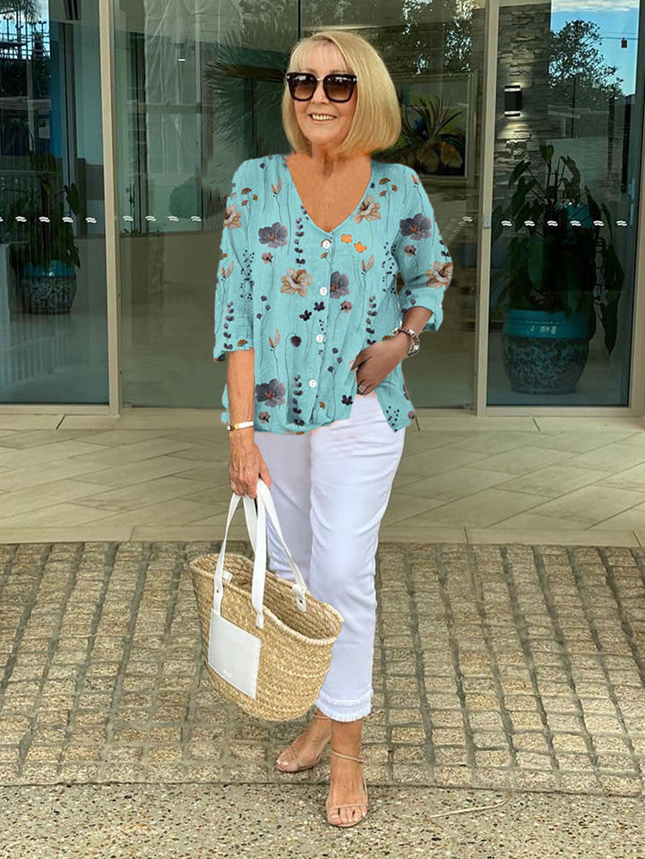 Floral three-quarter sleeve blouse worn
